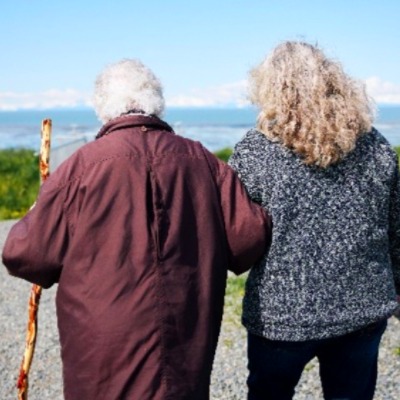 Elder walking with helper