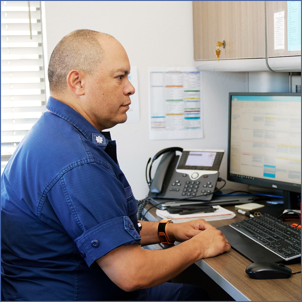 Man seated in front of computer